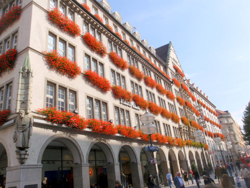 Building with beautiful flower baskets.